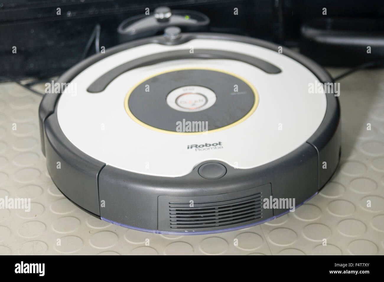 An iRobot Roomba robotic vacuum cleaner in its docking station Stock Photo Alamy