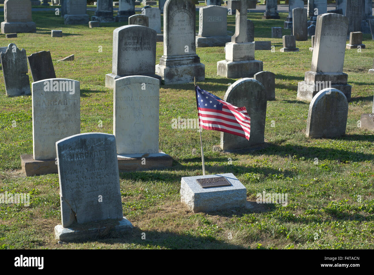 Cemetery with Tombstones and the American Flag Stock Photo