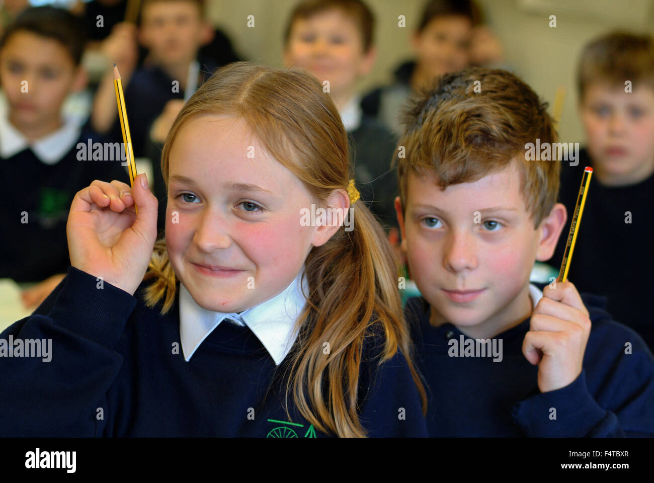 Primary school children uk hands up hi-res stock photography and images ...