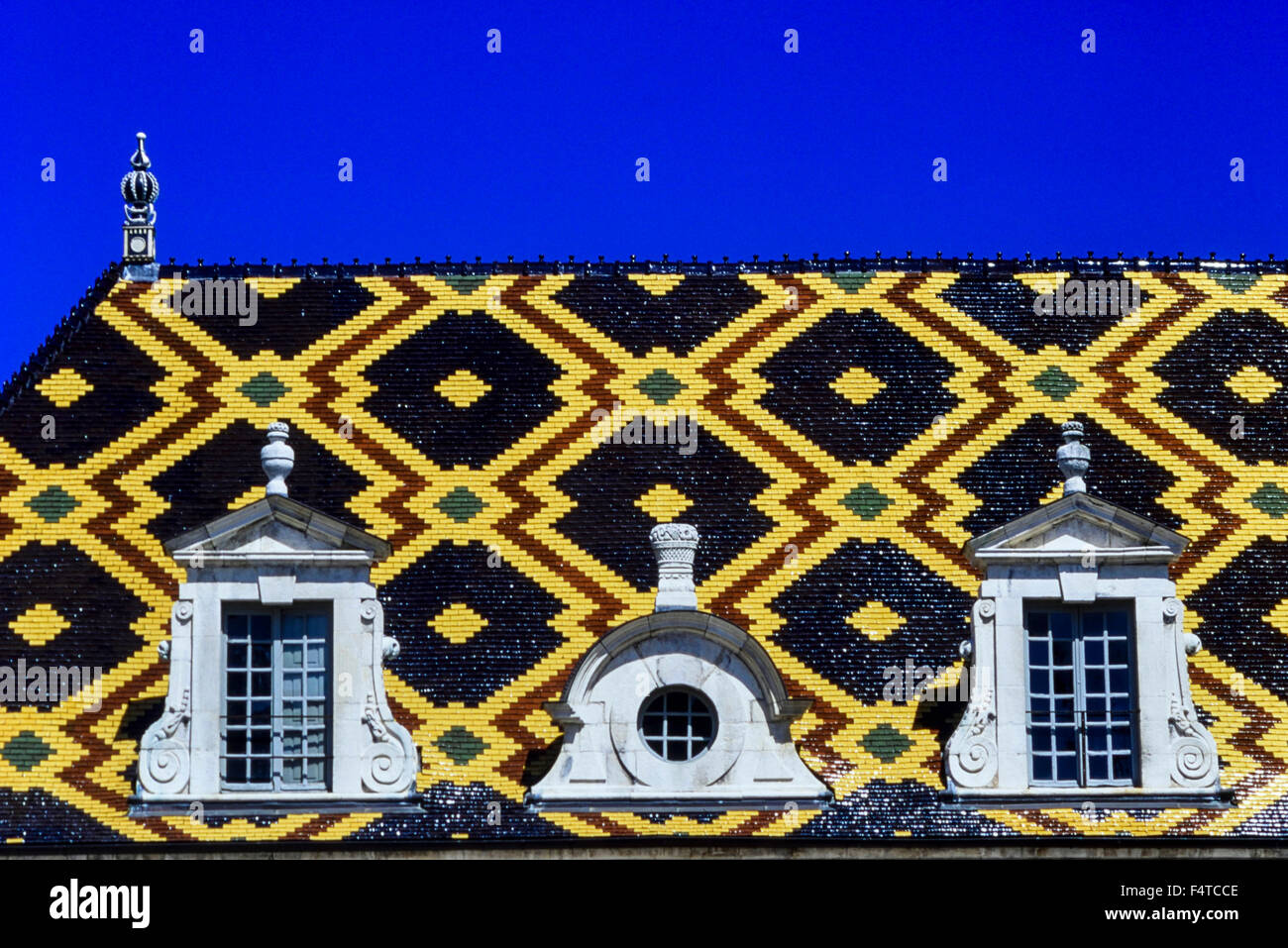 Detail of the Hospice de Beaune highly coloured and decorative roof tiles. Hotel Dieu, Beaune, Burgundy, Cote D'or, France Stock Photo