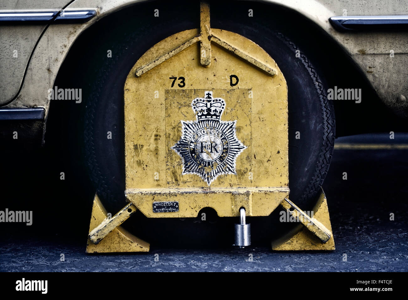 Metropolitan Police wheel clamp. London, UK Circa 1980's Stock Photo