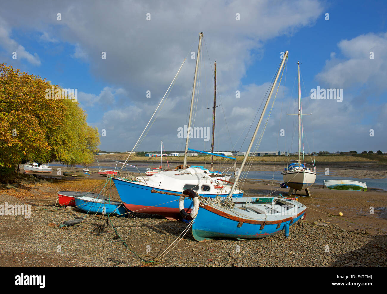 Boats moored on the Walney Channel at low tide, Walney Island, Cumbria, England UK Stock Photo