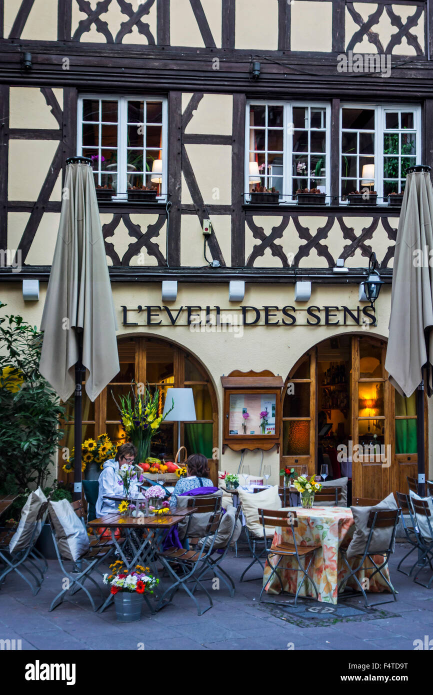 Laid tables outside in front of restaurant in the city Strasbourg, Alsace, France Stock Photo