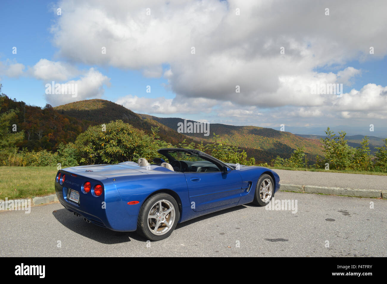 A Corvette Convertible sitting at an overlook on the Blue Ridge Parkway. Stock Photo