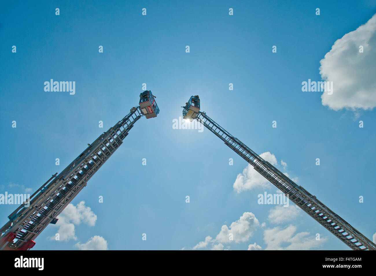 Germany, Bavaria, Germany, Teisendorf, fire brigade, ladder, aerial ladder, practise, exercise, back light, sky, sun Stock Photo