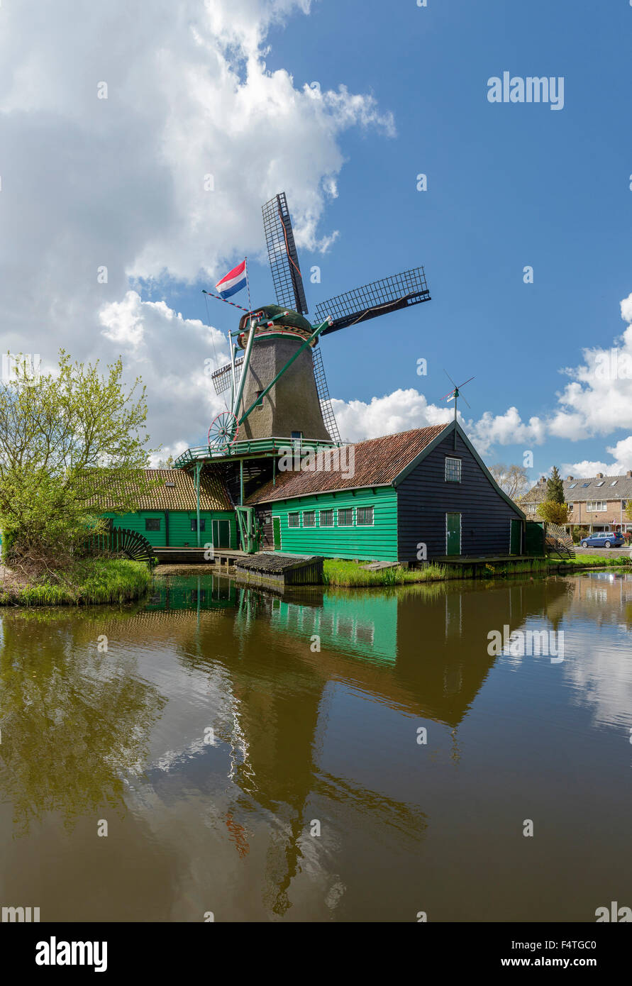 Windmill along the river Zaan Stock Photo