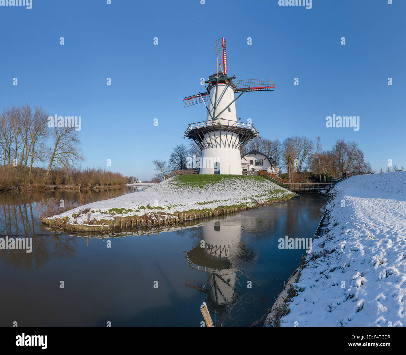 Pare producing windmill called The Schoolmaster (De Schoolmeester) Stock Photo