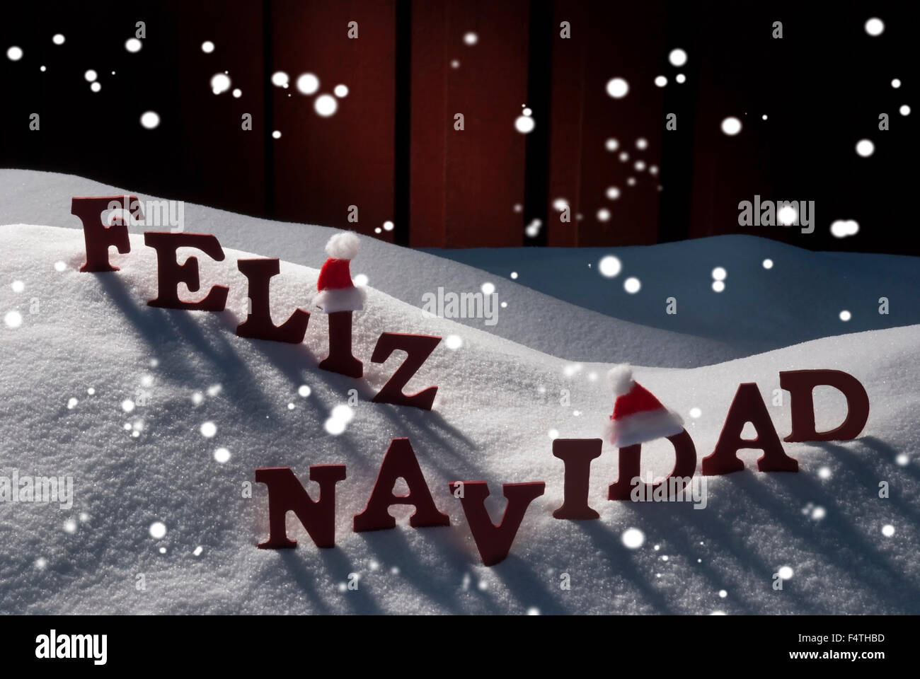 Card With Santa Hat, Snowflakes, Feliz Navidad Mean Christmas Stock Photo