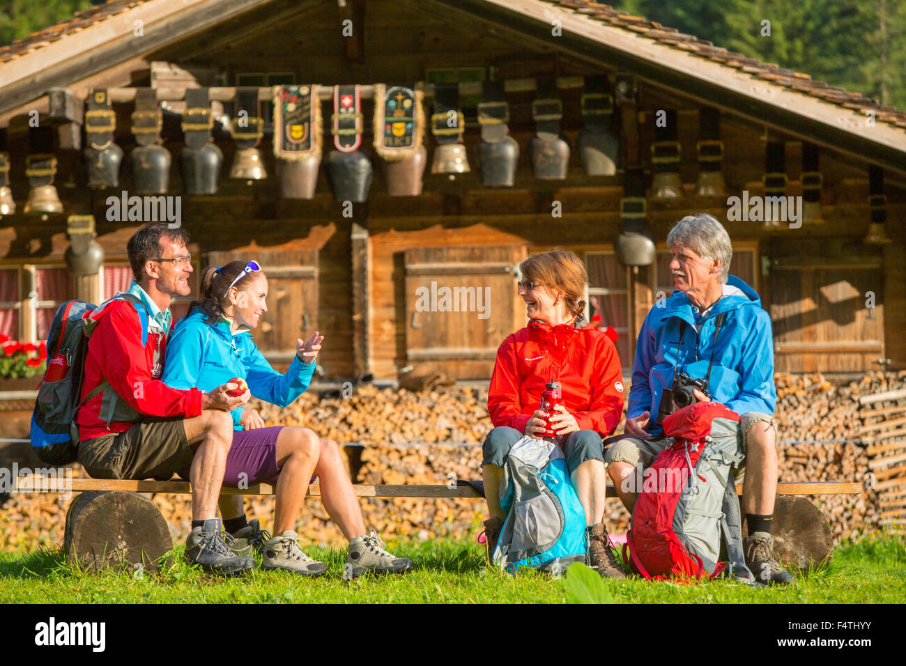 Hiker near alp hut in Rosenlaui, Stock Photo