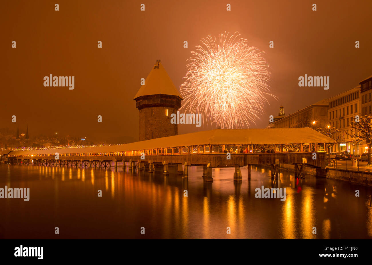 New Year fireworks over chapel bridge in Lucerne, Stock Photo