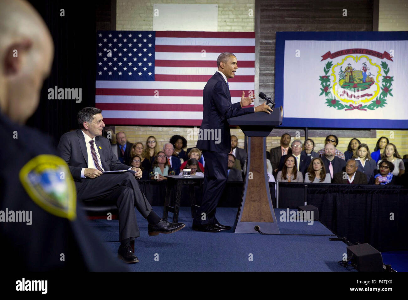 Charleston, West Virginia, USA. 22nd Oct, 2015. U.S. President Barack Obama gives remarks during a community forum on the prescription drug abuse and heroin epidemic at the East End Family Resource Center October 21, 2015 in Charleston, West Virginia. With the President on stage is Dr. Michael Botticelli, left, Director of the Office of National Drug Control Policy. Stock Photo
