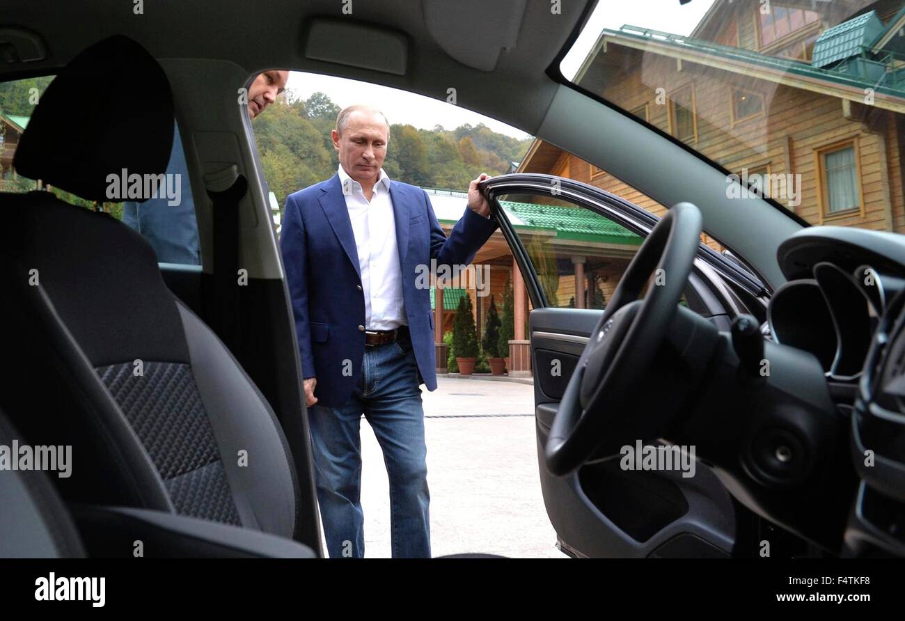 Russian President Vladimir Putin views the new Lada Vesta by AVTOVAZ car at the Bocharov Ruchey residence October 22, 2015 in Sochi, Russia. Stock Photo