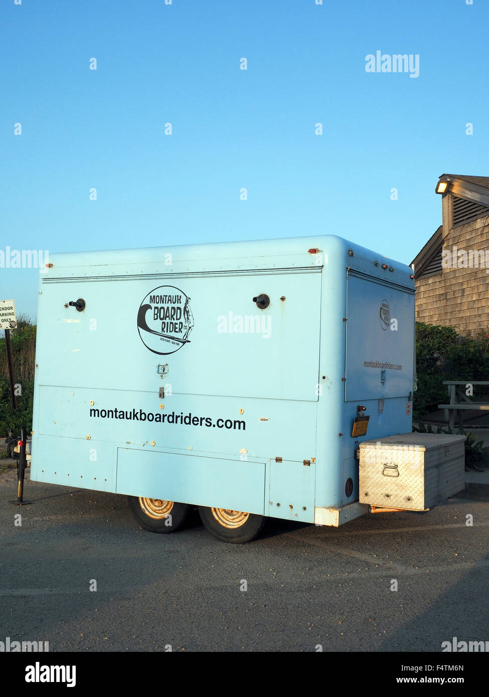 MONTAUK, NEW YORK-JUNE 23: A trailer for Montauk Board Riders surfing school is seen parked in lot by Ditch Plains beach, suppos Stock Photo