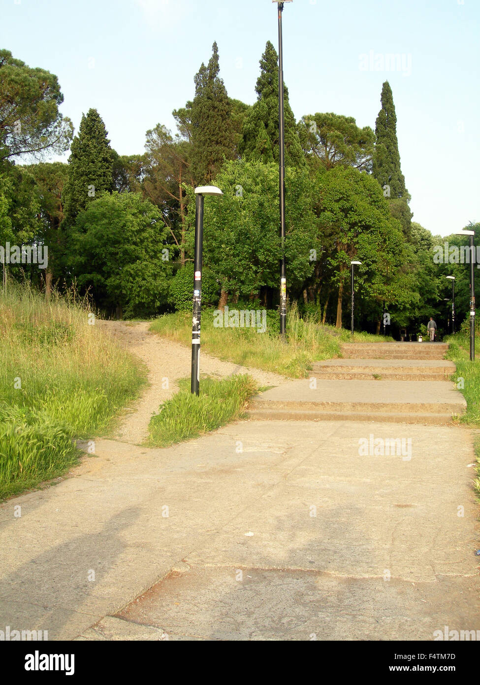 pedestrian walkway in outdoor park with trees gardens in capital city of Podgorica Montenegro Europe Stock Photo