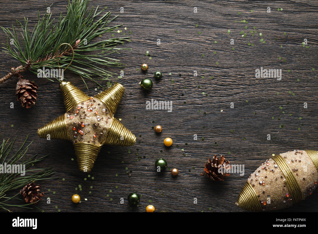 Dark Christmas background with golden decorations Stock Photo