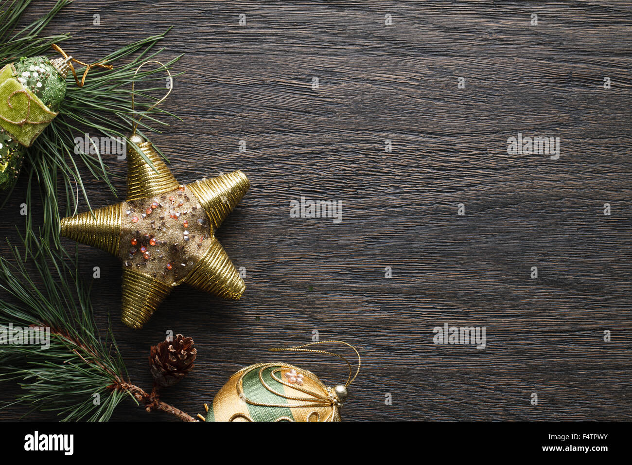 Dark Christmas background with golden decorations Stock Photo