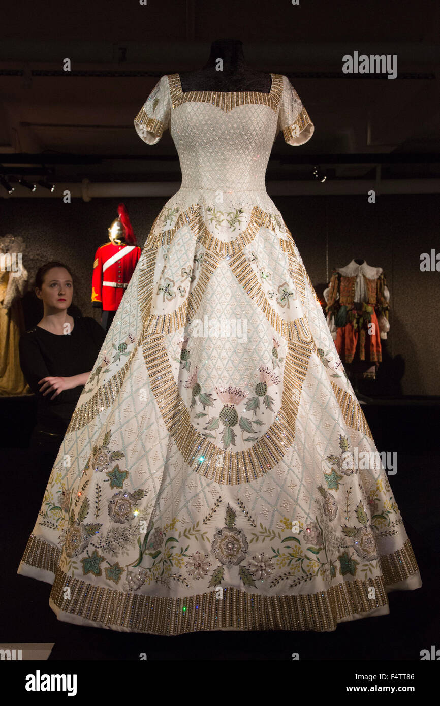 London, UK. 22/10/2015. Replica of Queen Elizabeth II Coronation Dress designed by Sir Norman Hartnell. Costumes from the exhibition Dressed by Angels, 175 years of costumes from costume house Angels. The exhibition, which is now booking through to 3 January 2016, features over 130 iconic costumes from the worlds of film, TV and theatre and also tells the story behind Angels, the world's greatest costume house. Stock Photo