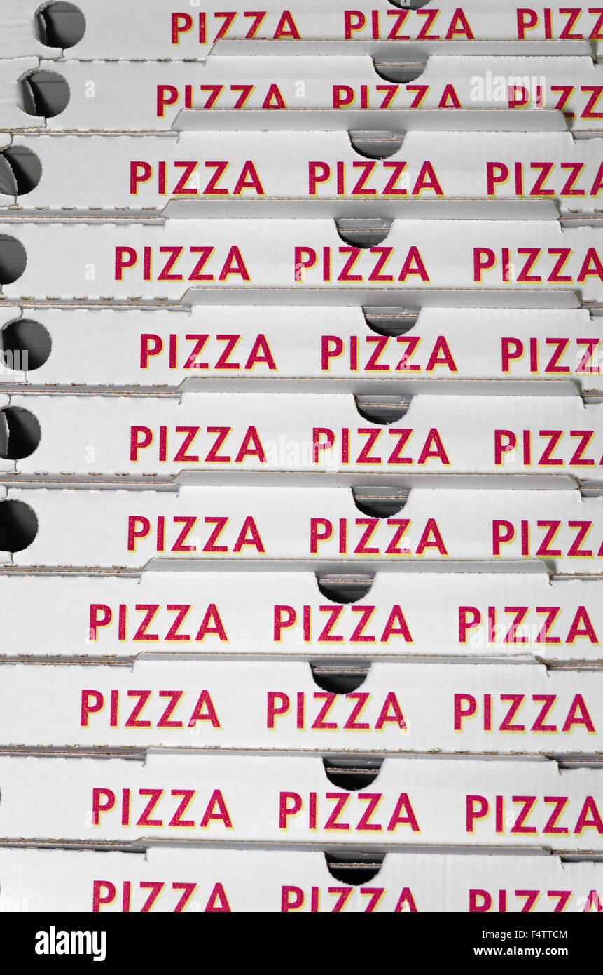 Piled pizza boxes ready for take away Stock Photo