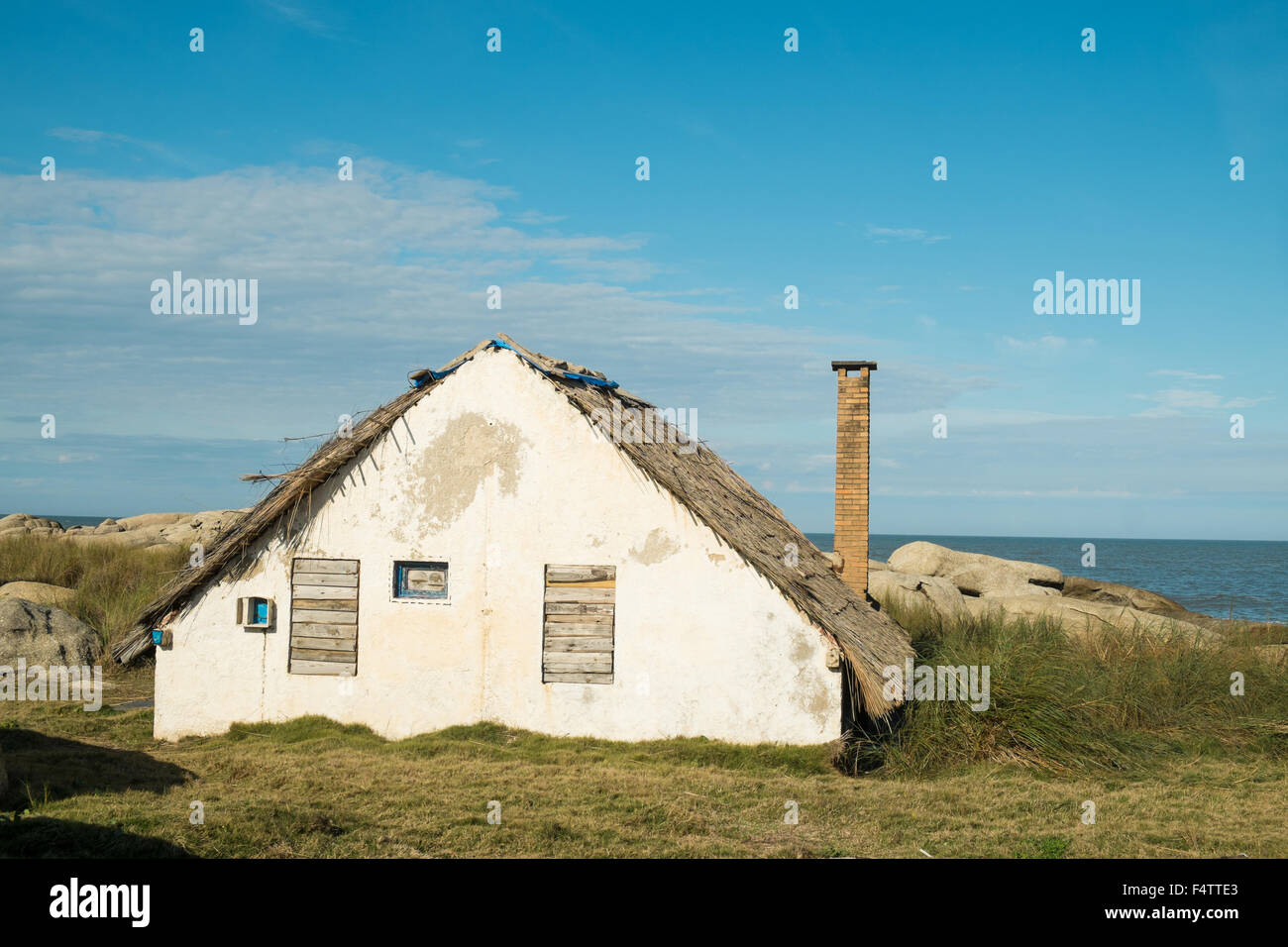 Traditional thatched houses at Punta del Diablo resort, Uruguay Stock Photo