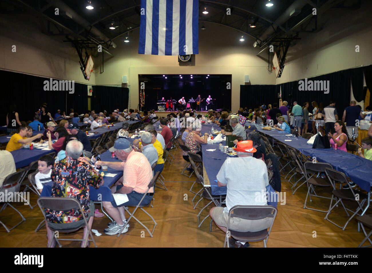 The banquet hall full of festival goers listening to Greek music at  the Greek festival in Annapolis, Maryland Stock Photo