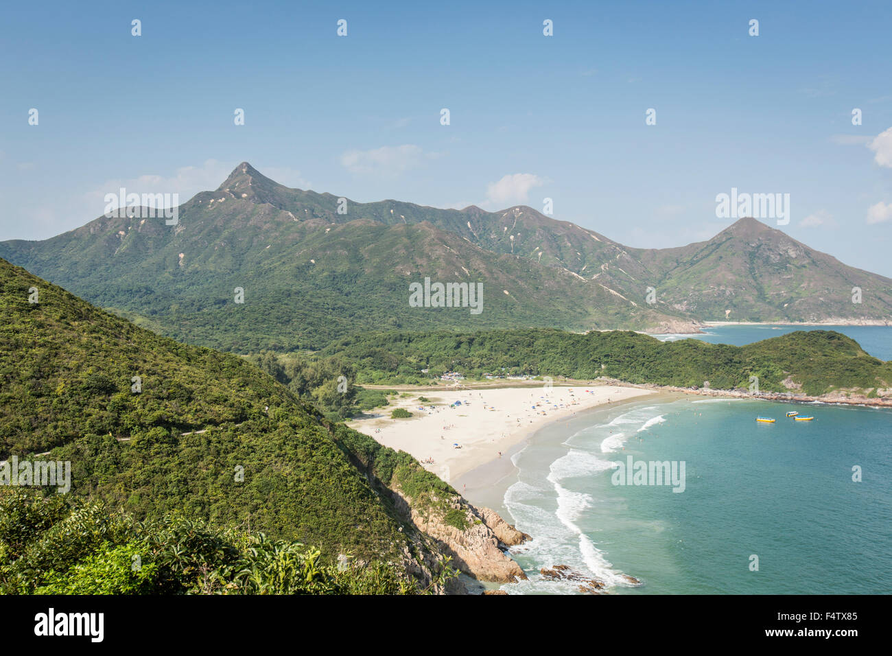 Hiking in New Territories, Hong Kong, via Sharp Peak, Ham Tim Beach and Tai Long Wan. Stock Photo