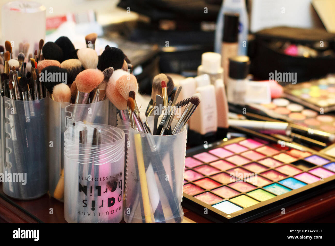 Table set-up of a makeup artist with different cosmetics, tools, brushes  Stock Photo - Alamy
