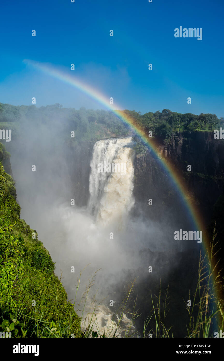 Victoria Falls, Zimbabwe - Victoria Falls Waterfall with rainbow Stock Photo