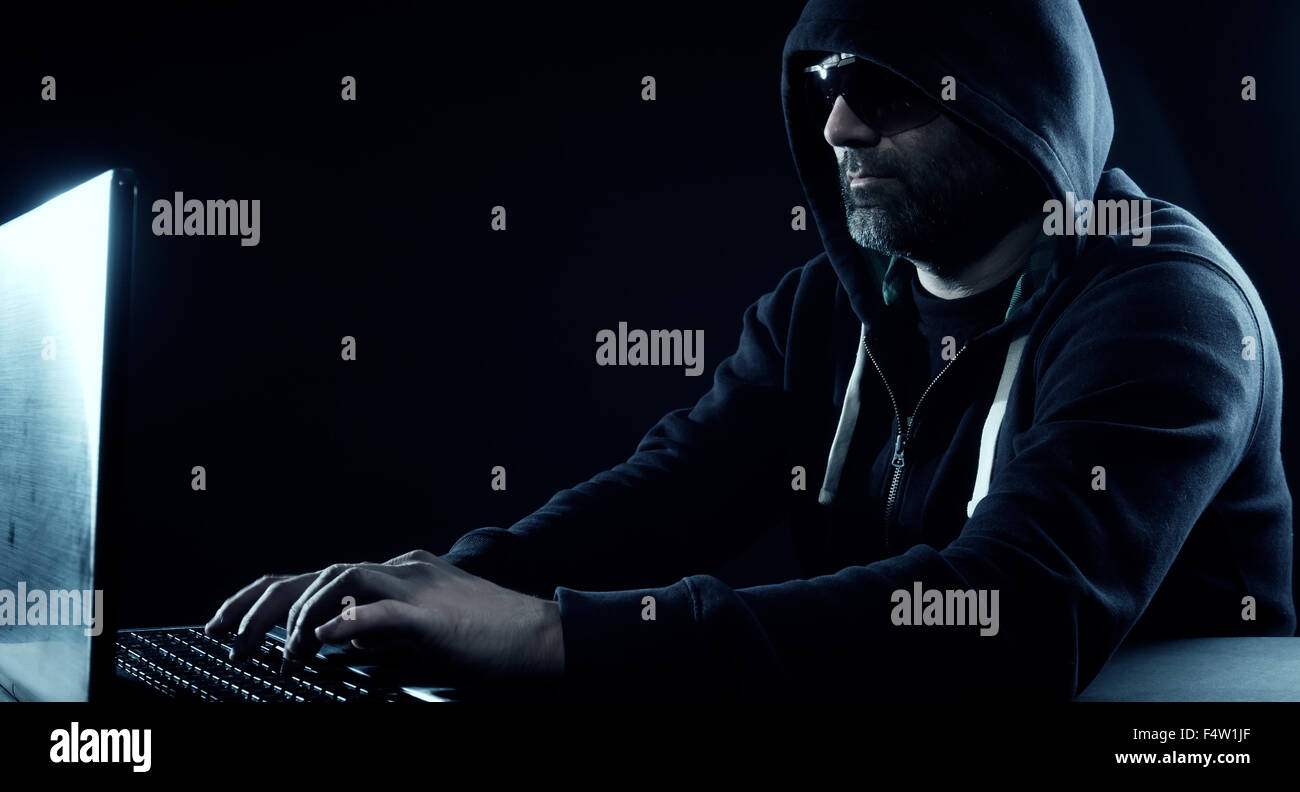 Hacker typing on futuristic computer hi-res stock photography and ...