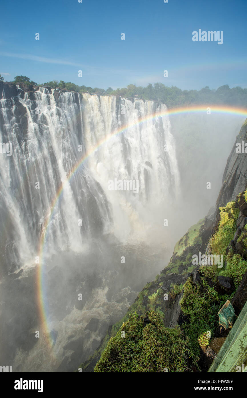 LIVINGSTONE, ZAMBIA - Victoria Falls Waterfall with rainbow Stock Photo