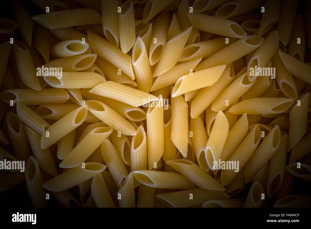 Extreme close up of uncooked Italian rigatoni pasta background Stock ...