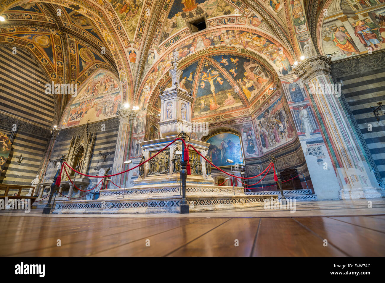 Interier of the baptisterium in The Duomo Cathedral in Siena, Tuscany ...
