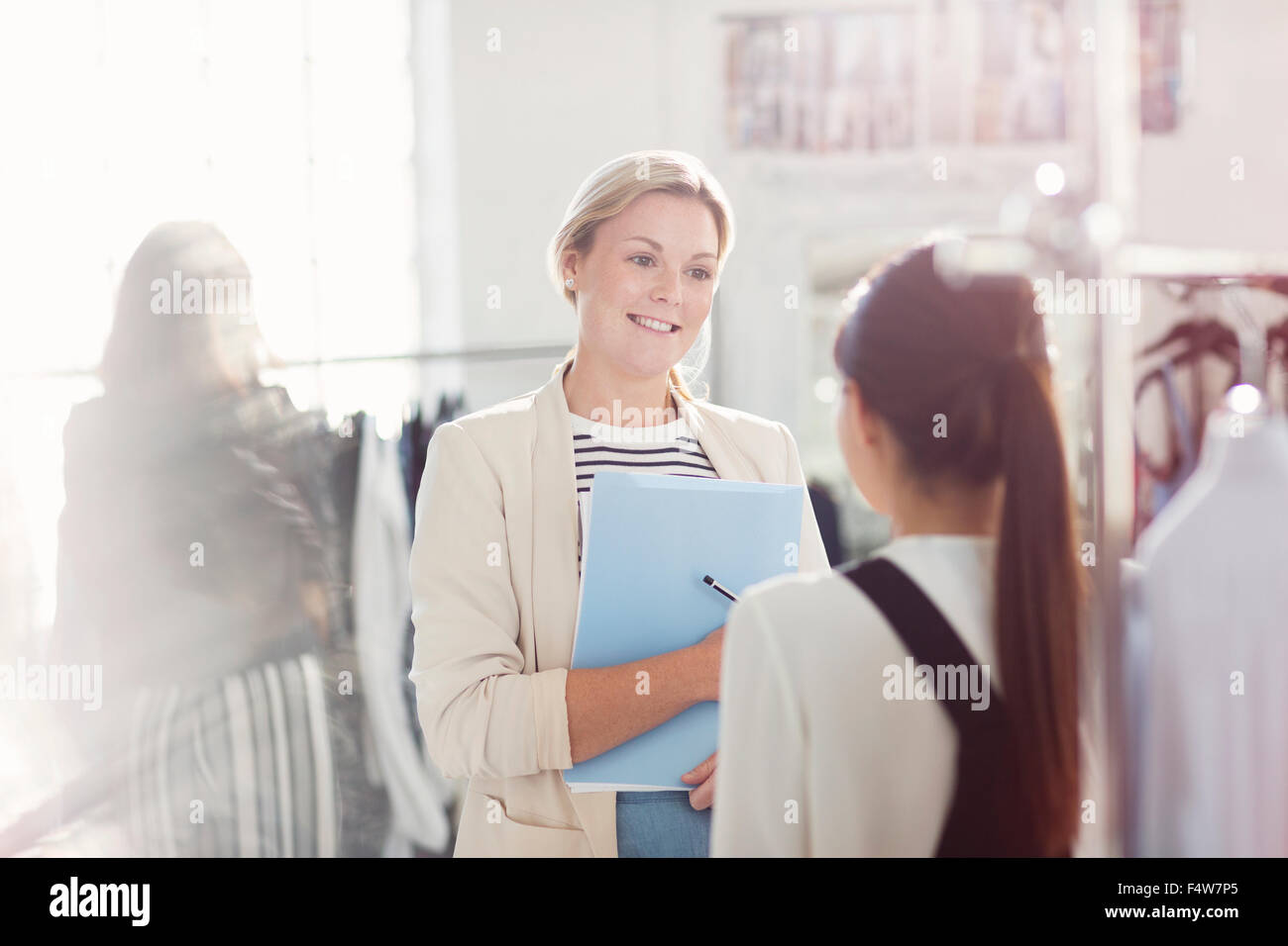 Fashion designers talking in office Stock Photo