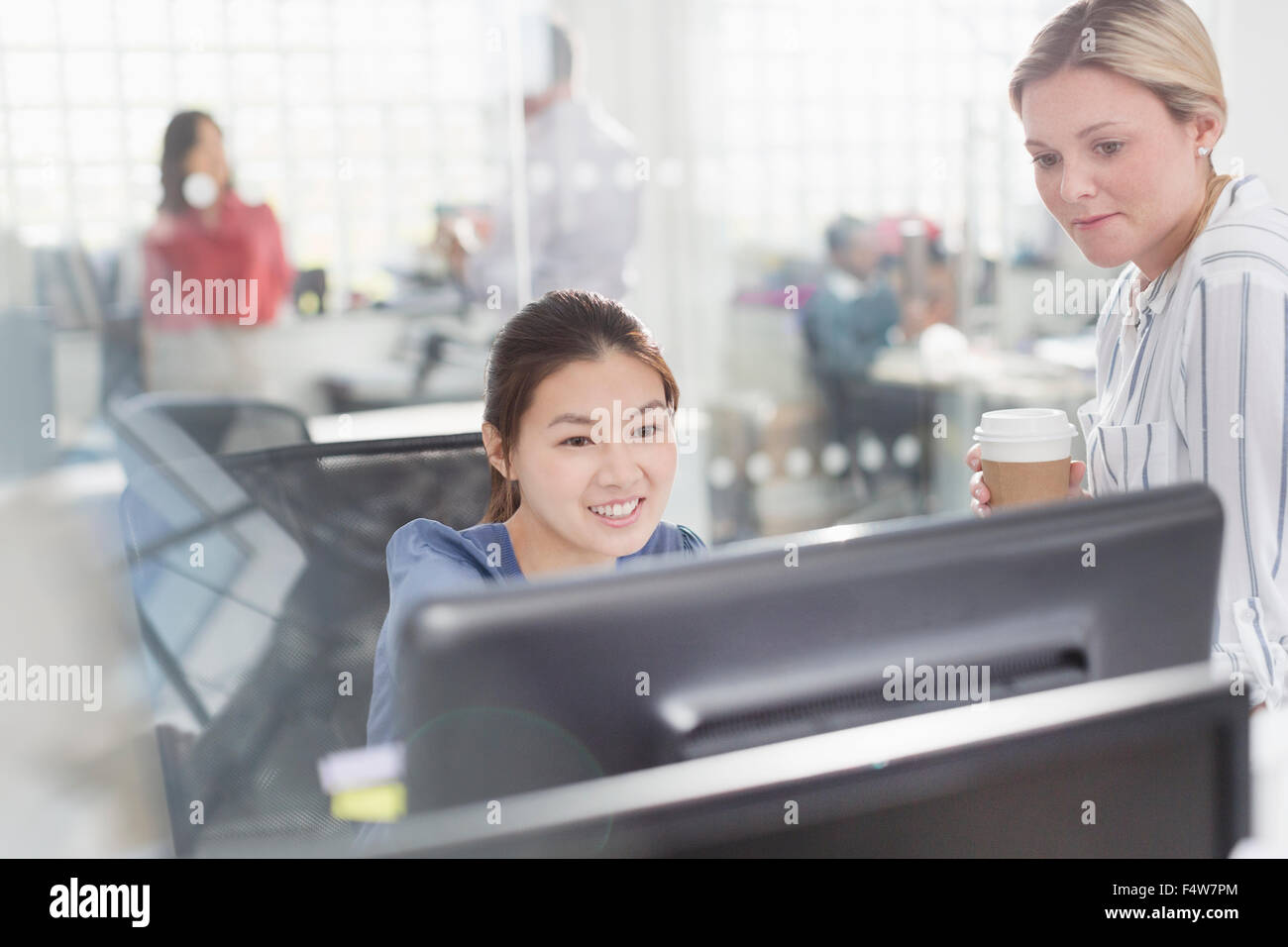 Businesswomen working at computer in office Stock Photo - Alamy