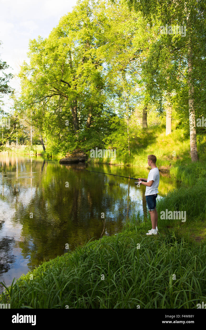 A young man fishing shirt hi-res stock photography and images - Alamy