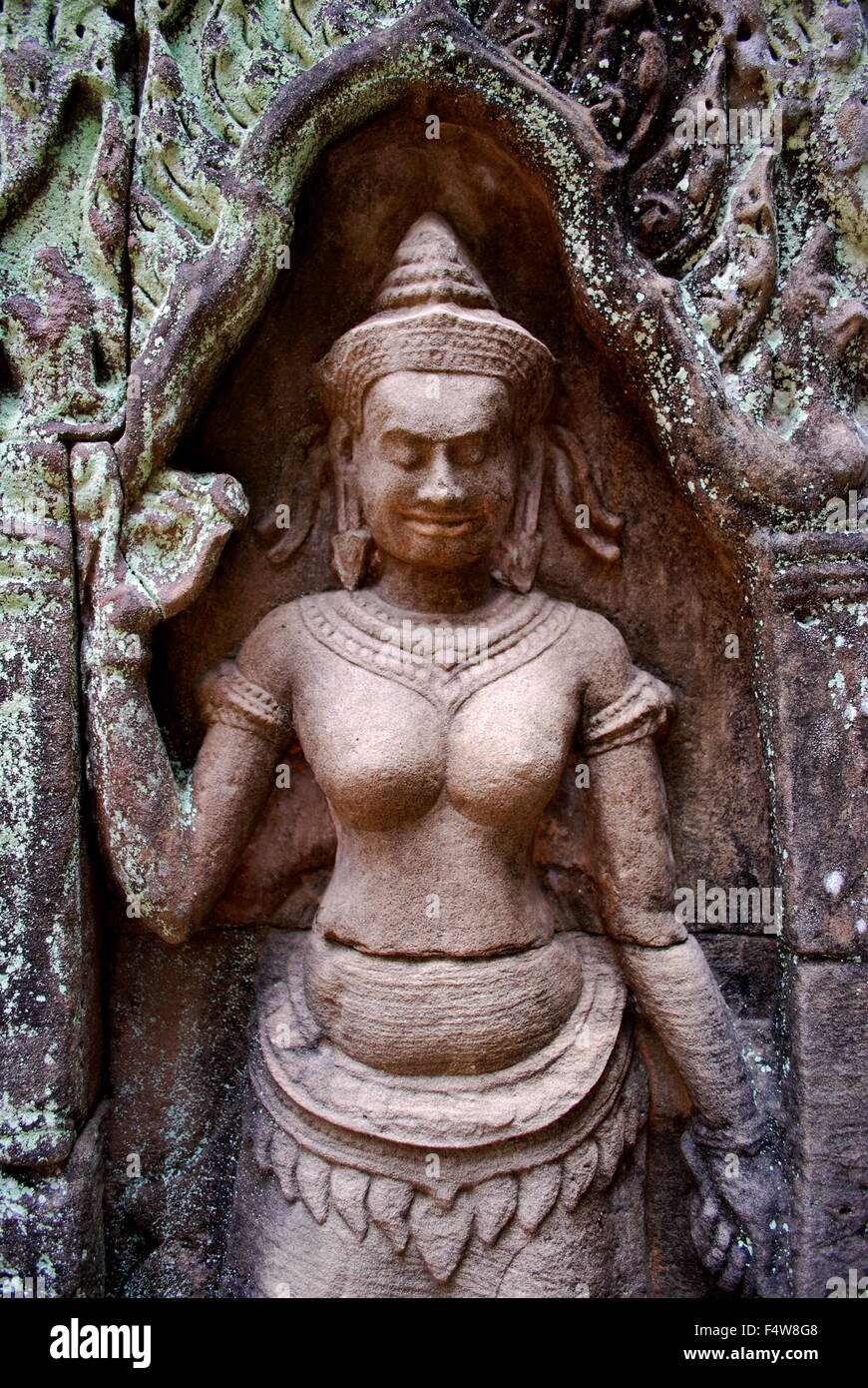 Stone carving of female goddess at the ruins of Preah Khan temple complex in Cambodia. Stock Photo