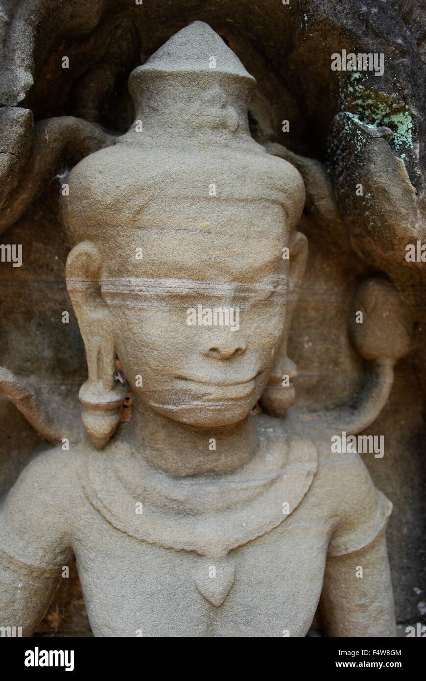 Stone carving of female dancer at the ruins of Preah Khan temple complex in Cambodia. Stock Photo