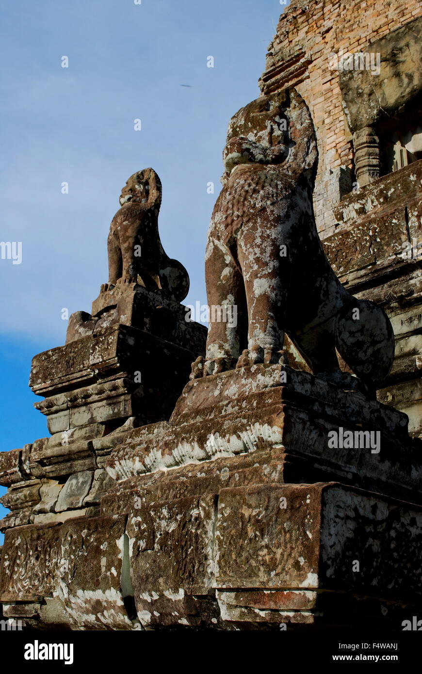 2 Stone Lion Guardians in front of temple at Pre Rup, The East Baray, Angkor Archaeological Park, Siem Reap, Cambodia Stock Photo