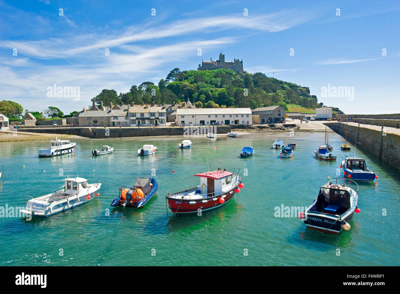 A view of St Michael's Mount with the harbour and village in the