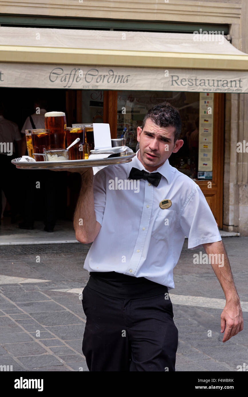 Waiter outside Caffe Cordina Stock Photo