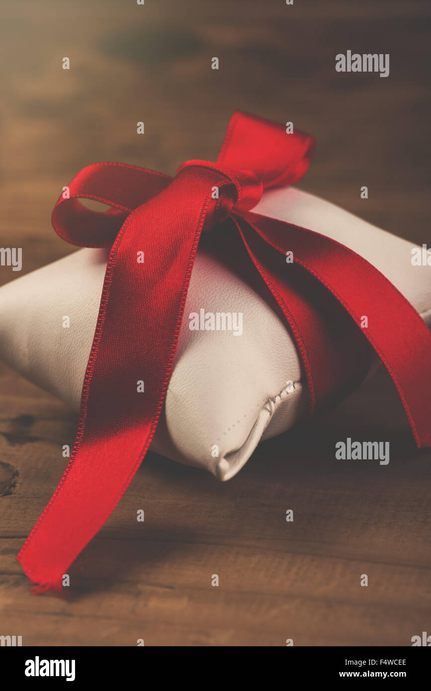 Red Wrapped Rippon Gift wrapped by red ribbon hi-res stock photography and images - Alamy