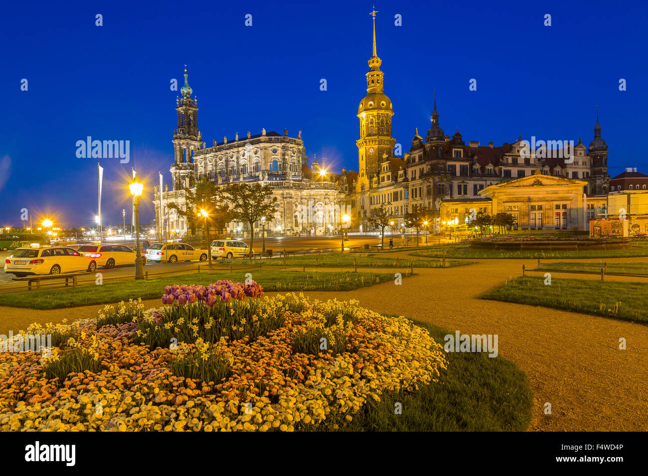 Theaterplatz, theatre square with equestrian monument, Hofkirche church, castle with Hausmannsturm tower and Schinkelwache, dusk Stock Photo