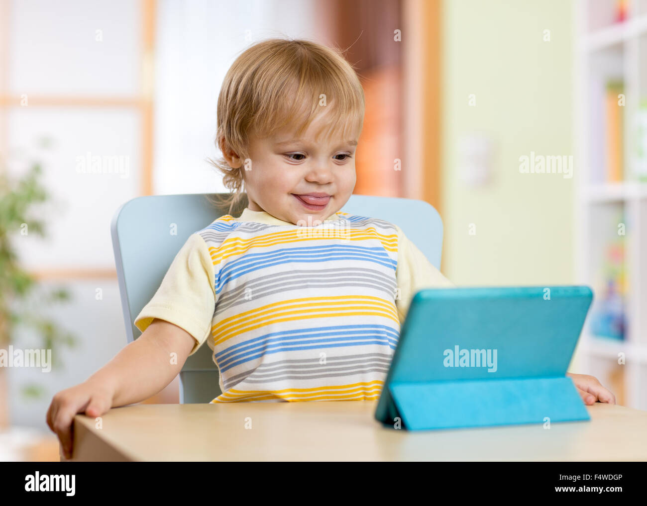 Cute child toddler boy with tablet pc Stock Photo