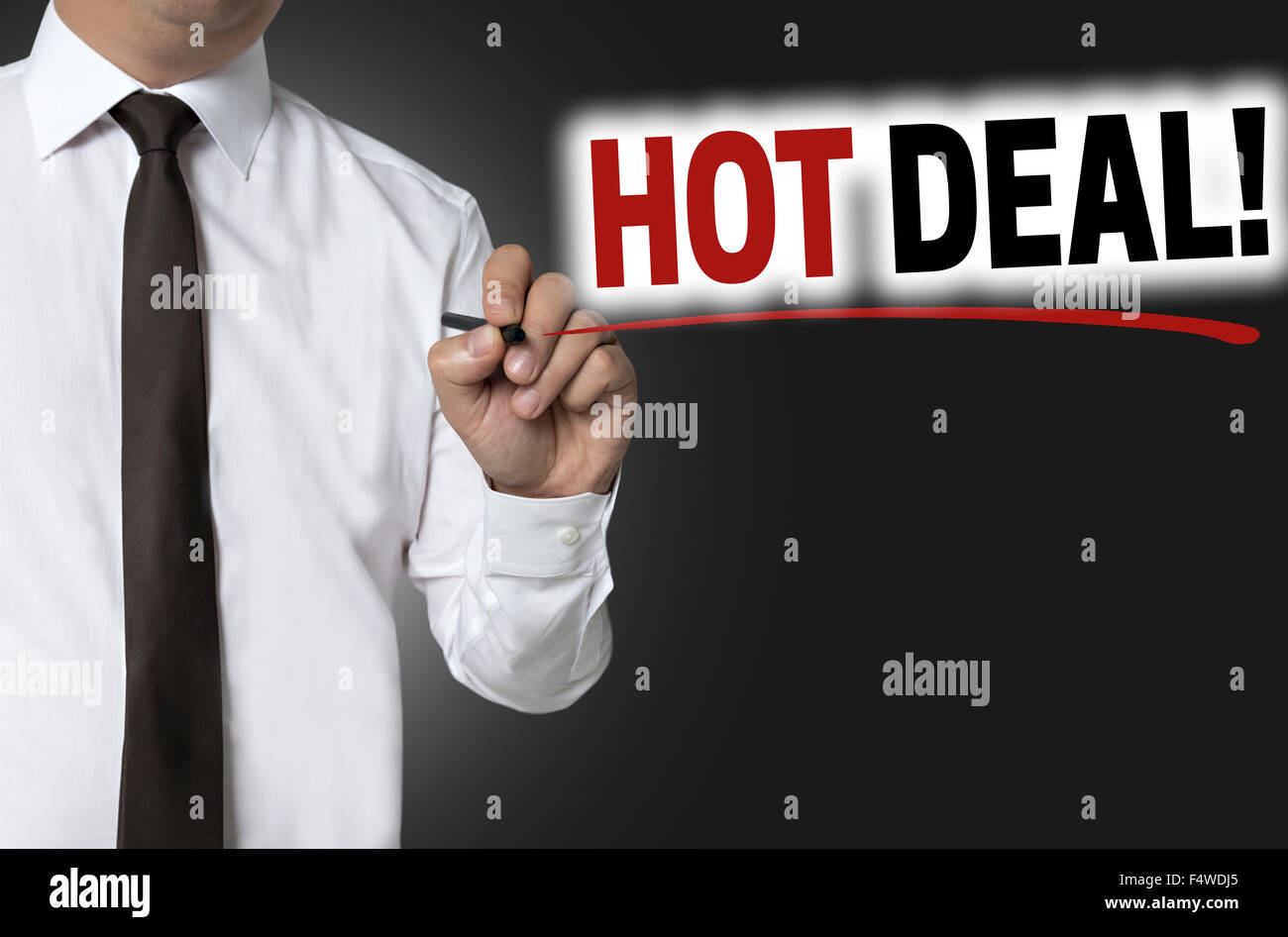 Hot deal is written by businessman background concept. Stock Photo