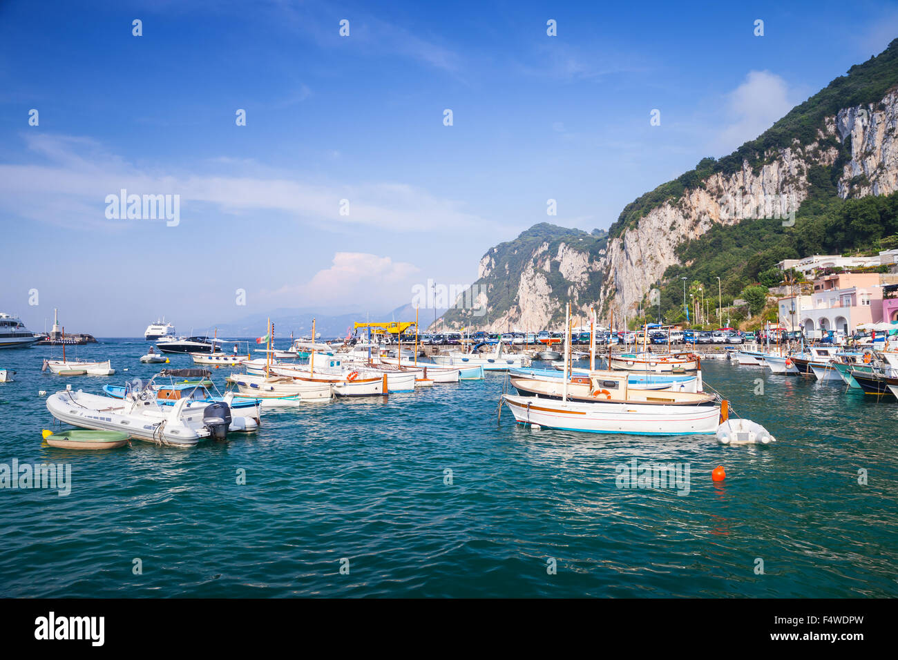 Port of Capri island, Italy. Colorful houses and moored boats Stock Photo