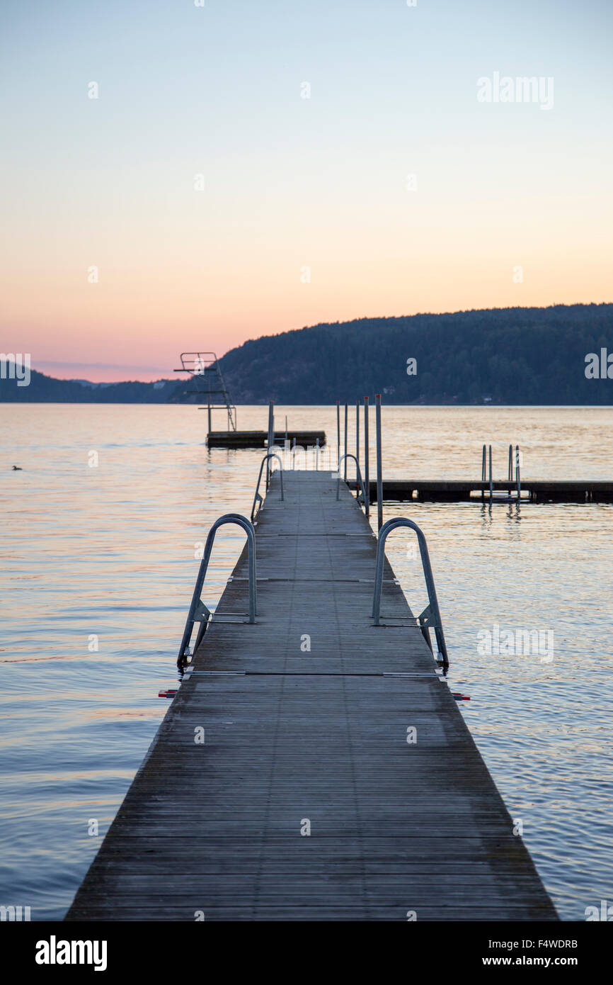 Sweden, Vastergotland, Lake Aspen, Jetty on lake at sunset Stock Photo -  Alamy