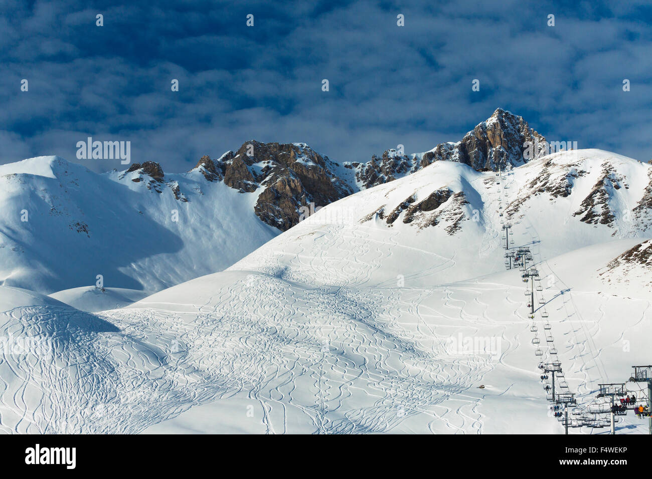 France, Rhône-Alpes, Savoie, Val D'Isere, View of ski lift in snowcapped mountains Stock Photo