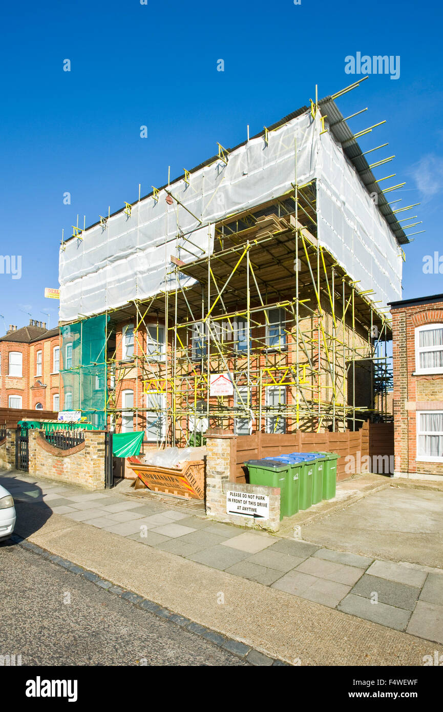 A loft conversion to a Victorian/Edwardian London suburban house showing the scaffolding and temporary roof. Stock Photo
