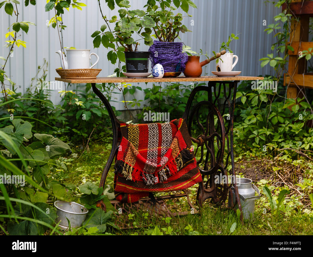 Old sewing machine as element of garden decoration Stock Photo