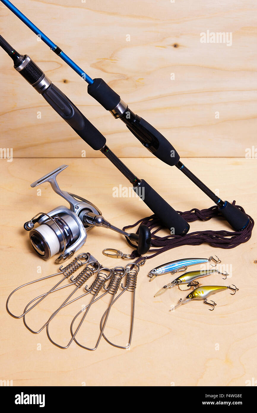 Fishing rods and reel with plastic baits. Fish stringer on the wooden  background Stock Photo - Alamy
