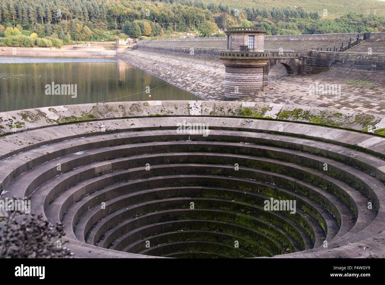 DERBYSHIRE UK - 06 Oct : Ladybower reservoir bellmouth overflow (or plug hole) and draw off tower on 06 Oct 2013 in the Peak Dis Stock Photo